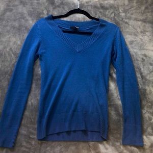 Blue long sleeve sweater/shirt.